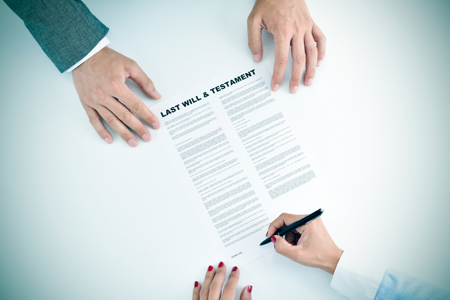 Young Woman Signing a Last Will and Testament Document